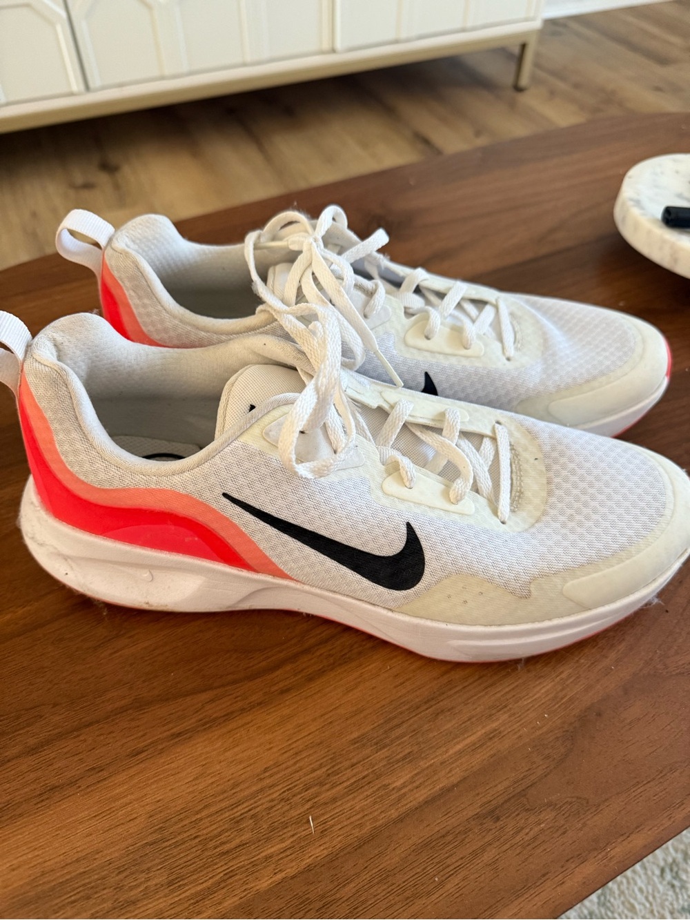 Nike white sneakers with Black Swoosh and Neon Coral Accent